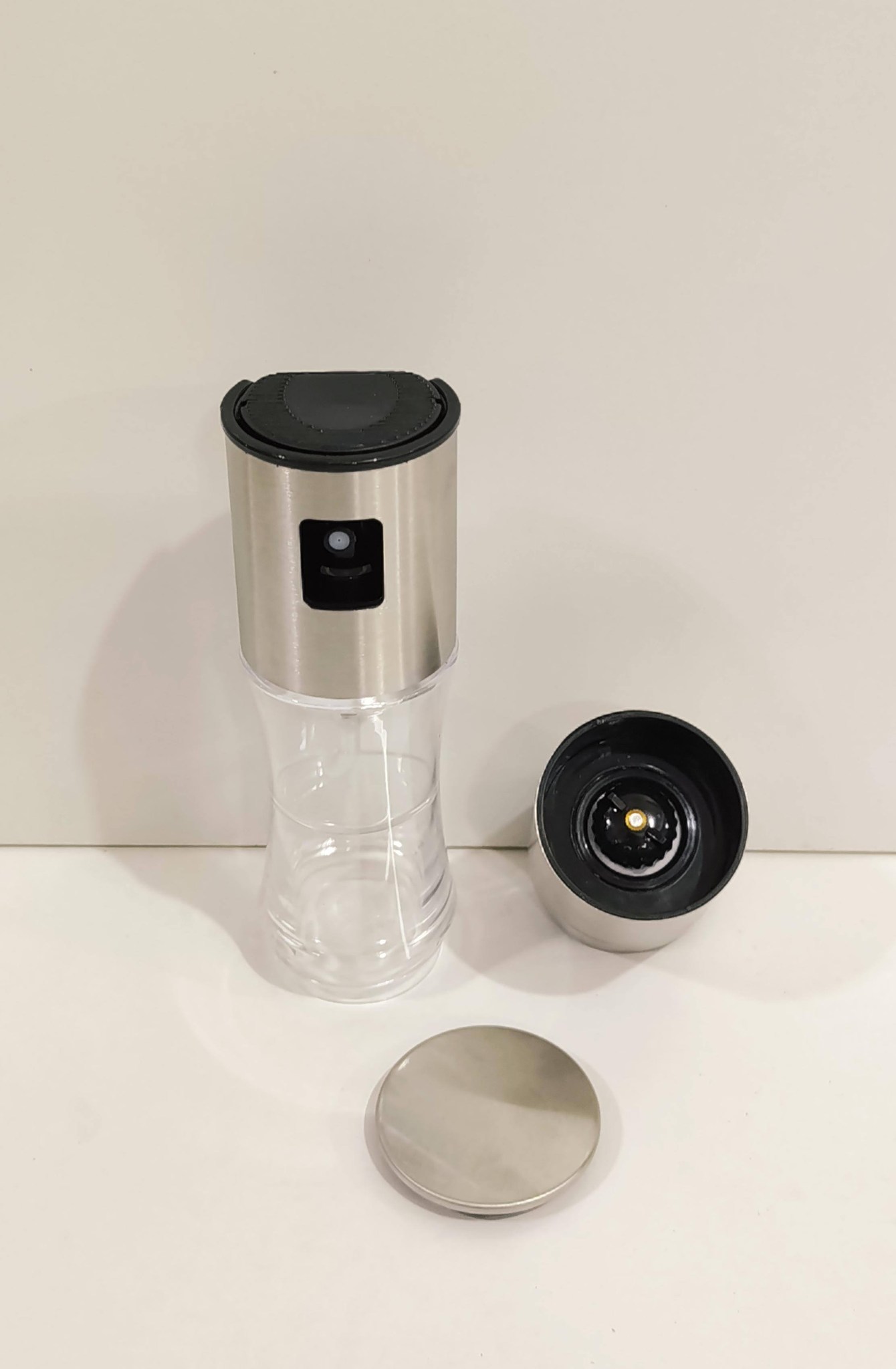 oil spray bottle with spices salt grinder
