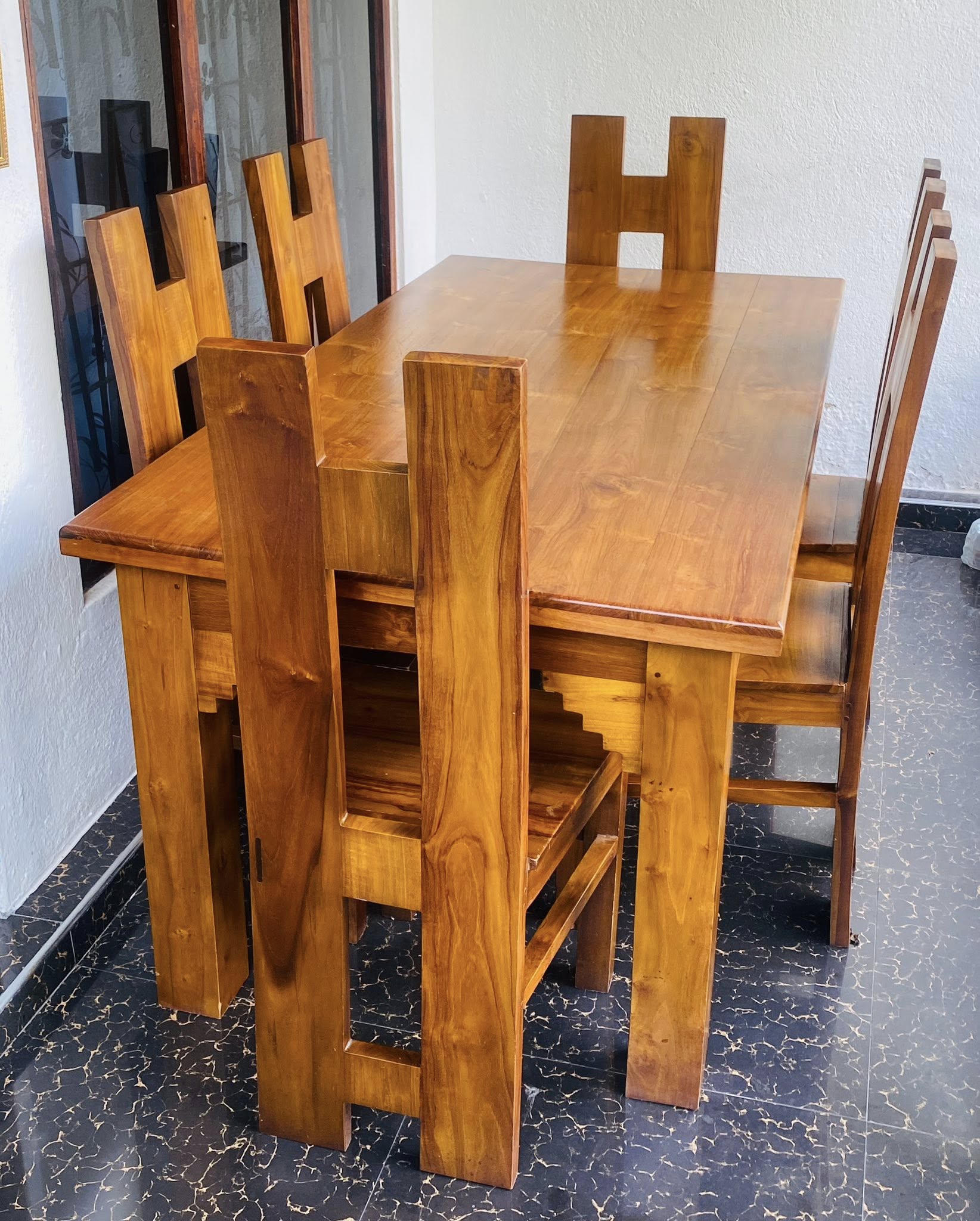 Used teak dining table with 6 chairs